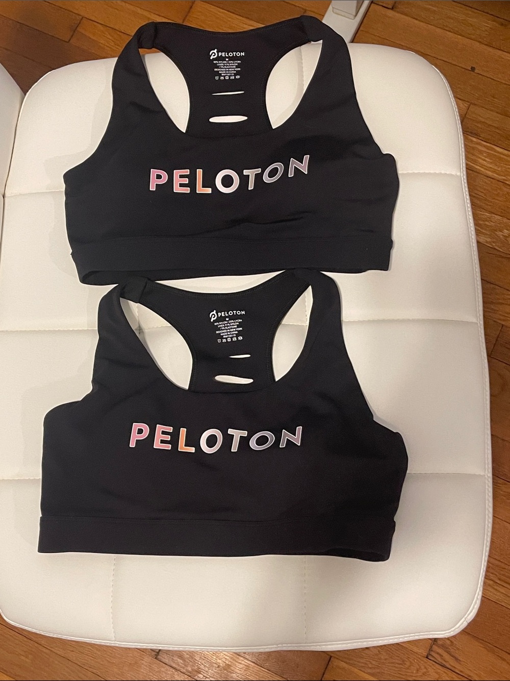TWO Peloton Black Racerback Sports Bra with Logo- NEVER WORN- size MEDIUM